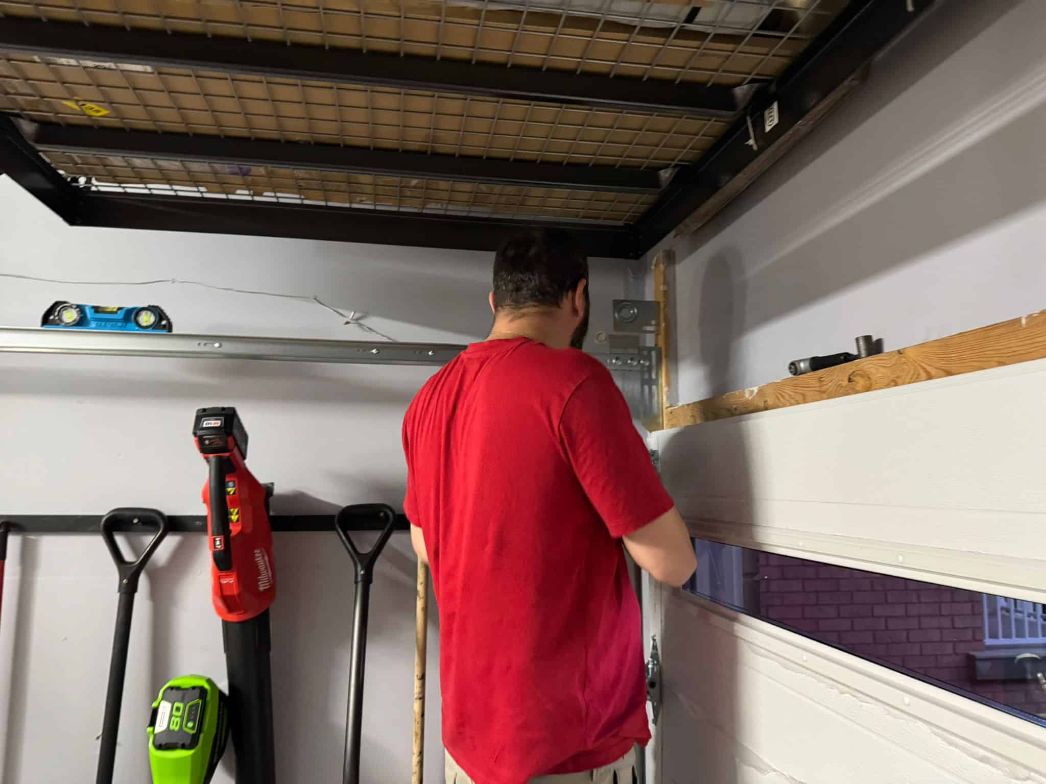 Kobi from Lion Pro repairing a garage door spring in York Region
