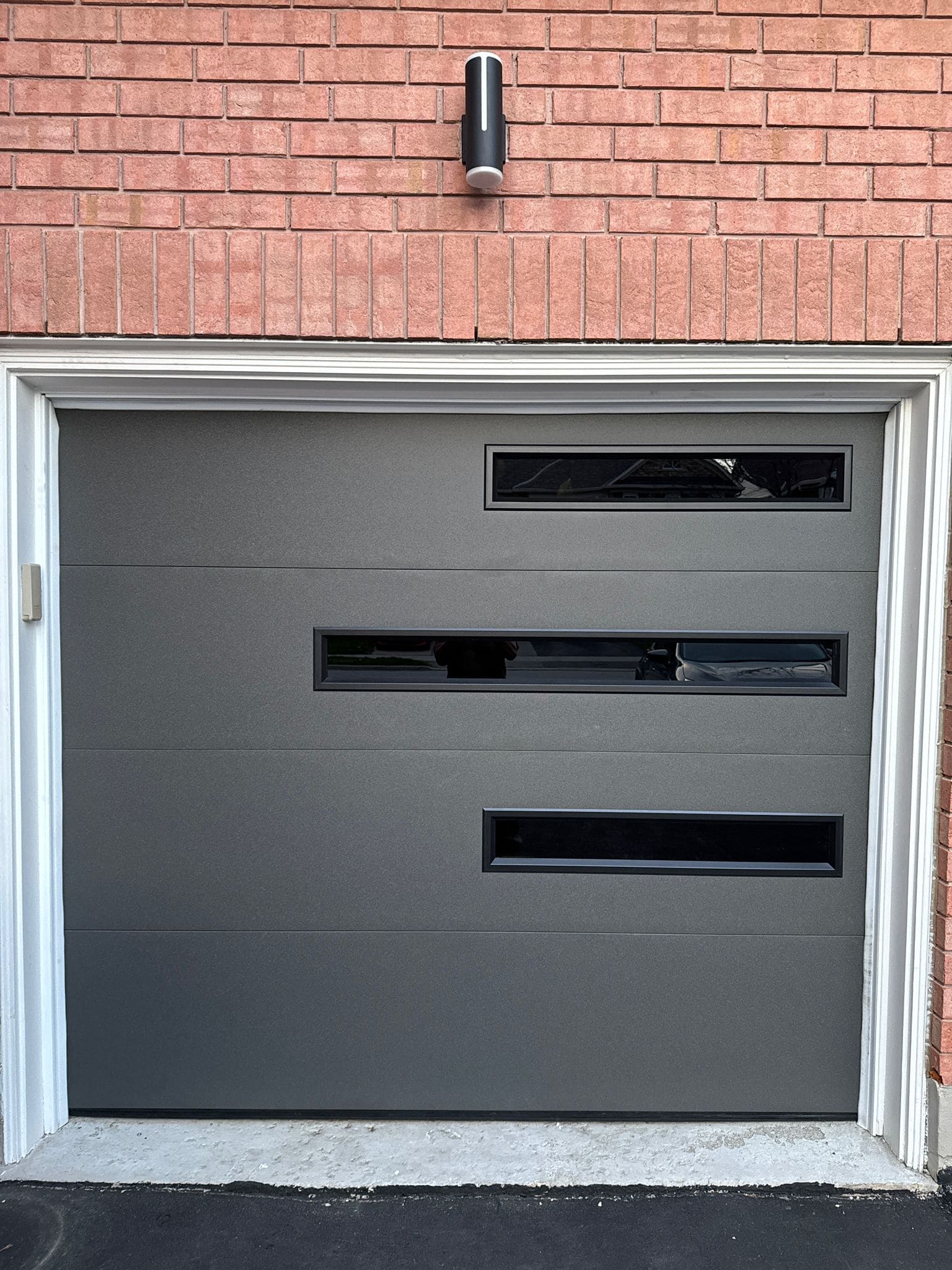 Kobi from Lion Pro working on a garage door repair